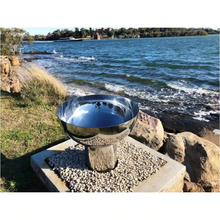 Load image into Gallery viewer, The Goblet Stainless Steel Fire Pit on the 300mm stand at the seaside