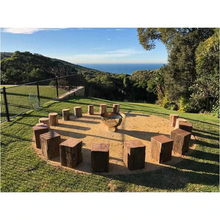 Load image into Gallery viewer, The Goblet Stainless Steel Fire Pit in the middle of log seats