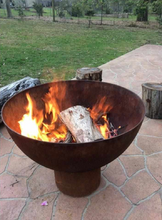 Load image into Gallery viewer, The Goblet Fire Pit with burning fire in garden