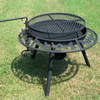 The Ultimate BBQ Fire Pit set up on a green grass with the Stockman pattern of horses and a stockman on a horse.