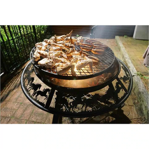 The Ultimate BBQ Fire Pit with sausages and chicken wings cooking