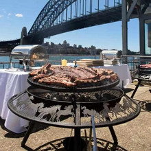 Load image into Gallery viewer, Cooking up a meat feast on the Ultimate BBQ Fire Pit