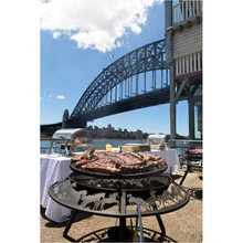 Load image into Gallery viewer, Cooking up a meat feast on the Ultimate BBQ Fire Pit