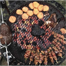 Load image into Gallery viewer, The Ultimate BBQ Fire Pit cooking up a feed