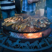 Load image into Gallery viewer, Cooking meat on the Ultimate BBQ Fire Pit